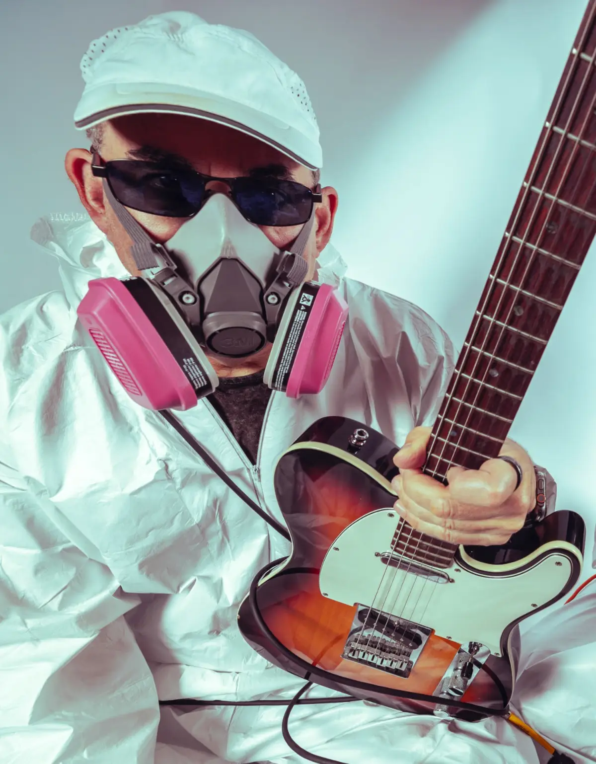 Brushstrokes in respirator and hazmat suit playing a telecaster